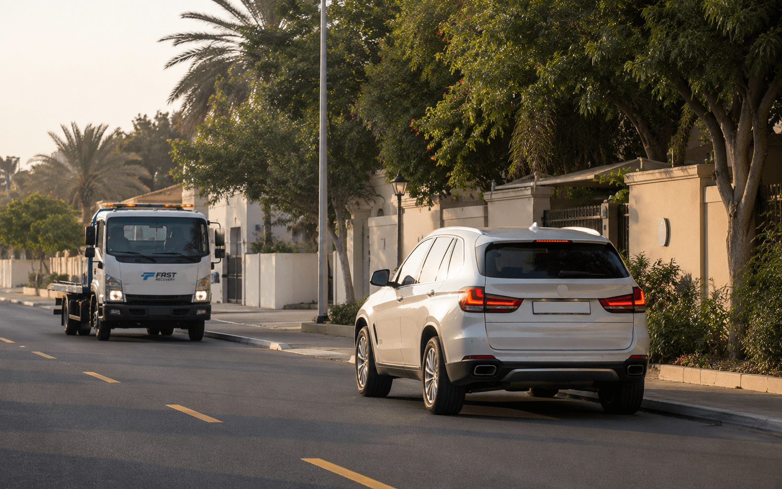 FAST RECOVERY truck arriving to assist a vehicle in Al Rashidiya