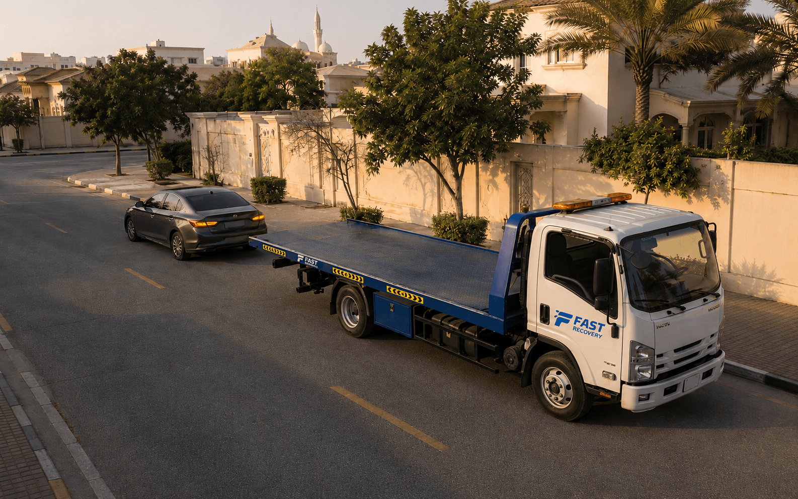 FAST RECOVERY truck beside a disabled vehicle in Al Twar